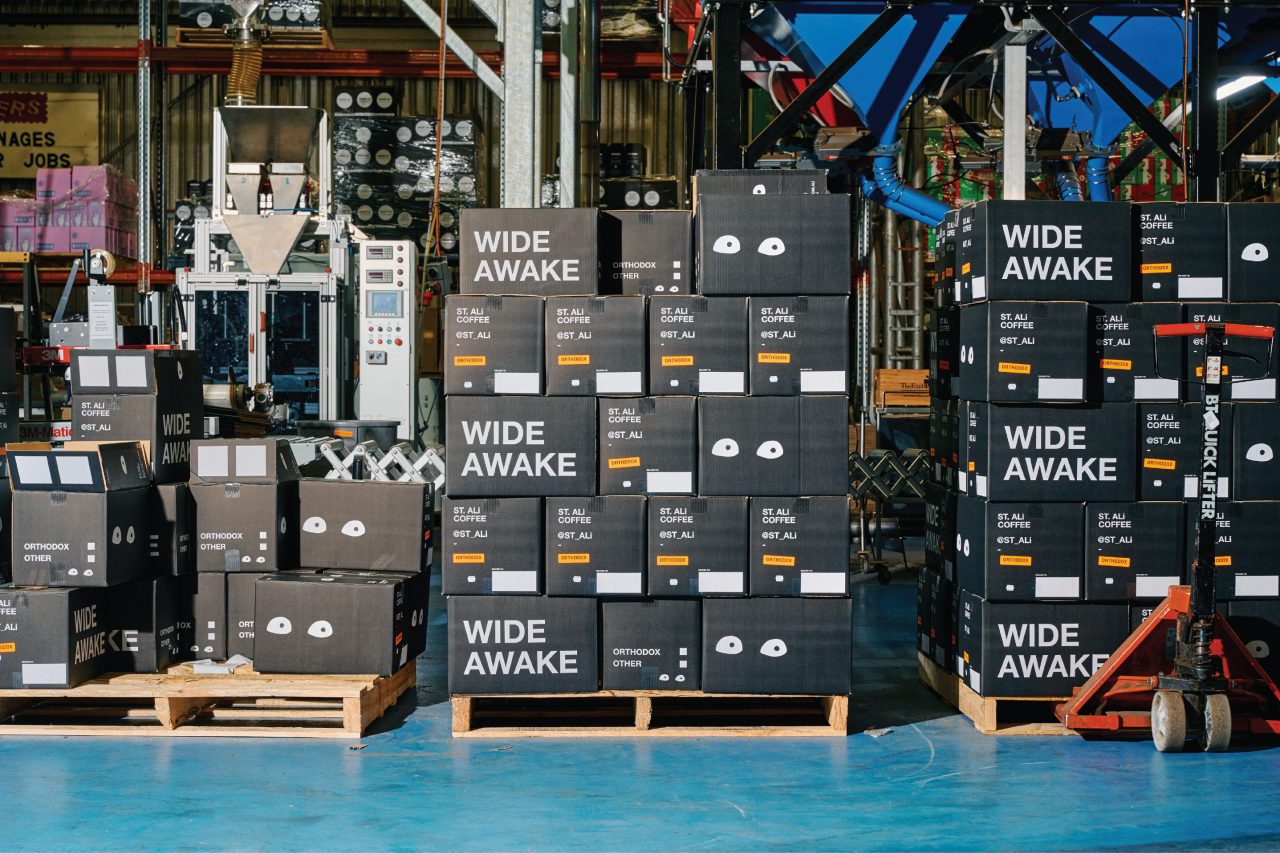ST. ALi product packaging in boxes on crates.