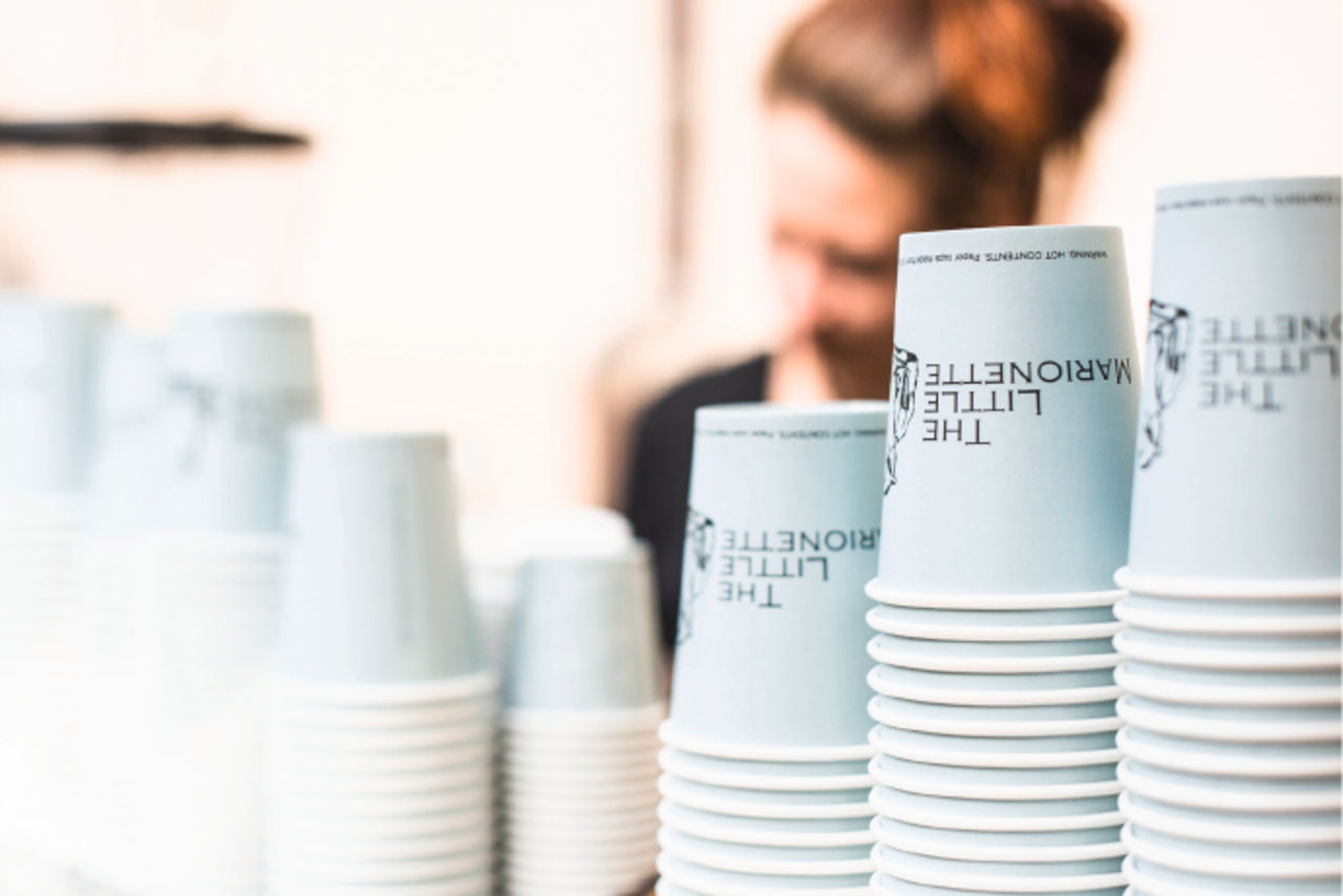 The Little Marionette coffee cups piled up.