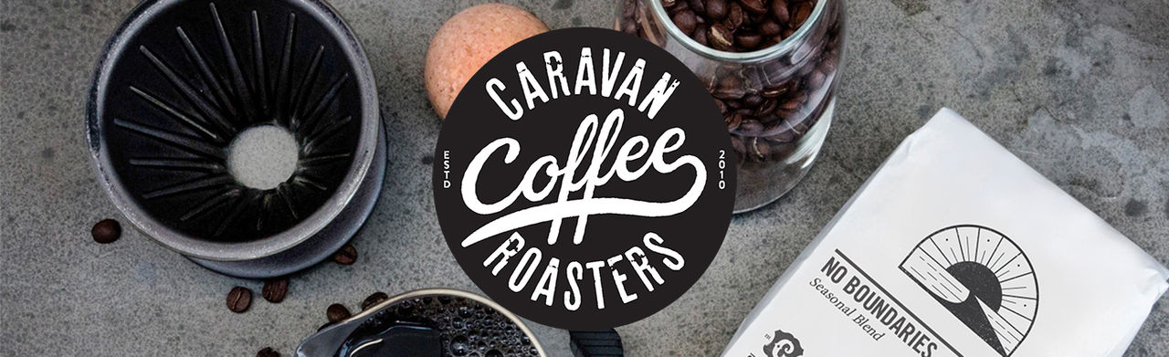 The Caravan logo, coffee beans and a bag that reads 'NO BOUNDARIES Seasonal Blend'.