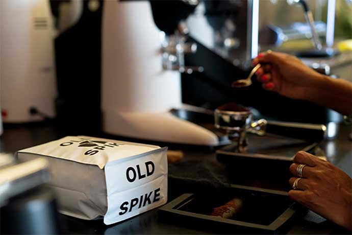 Old Spike coffee bag and a coffee machine in the background.