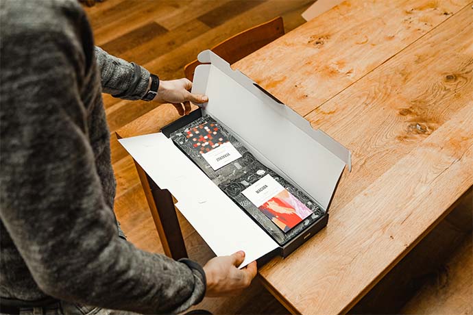 A customer opening up an Origin coffee package. 