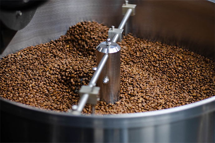 Coffee of the Month bag next to a filter machine.