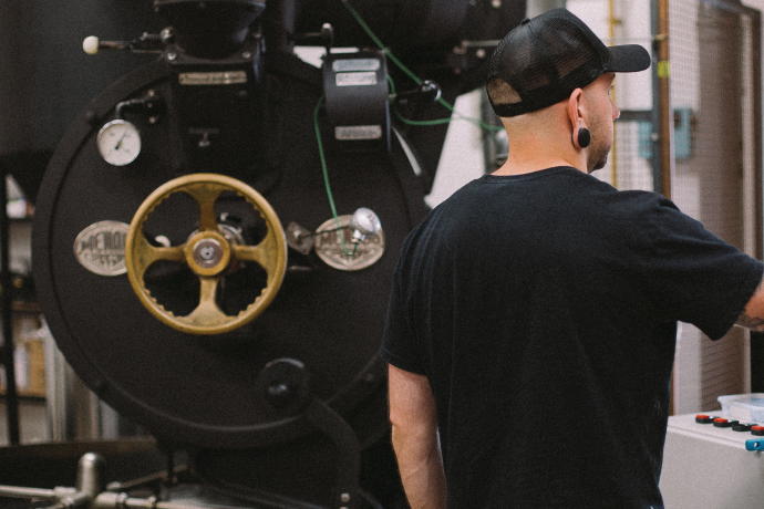 Roastworks speciality coffee worker in roastery