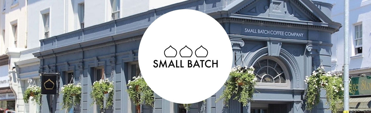 Small Batch logo and a grey building with SMALL BATCH COFFEE COMPANY on the facade.