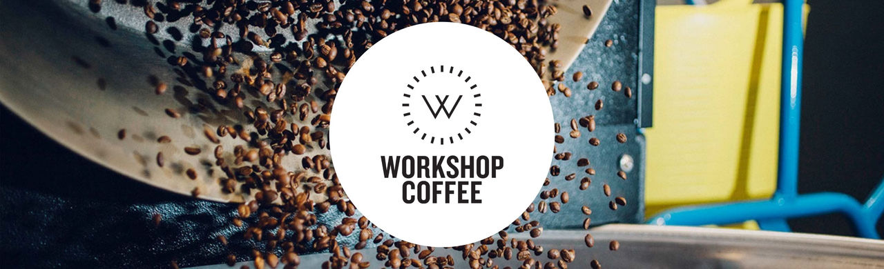 Workshop logo and coffee beans mid-air.