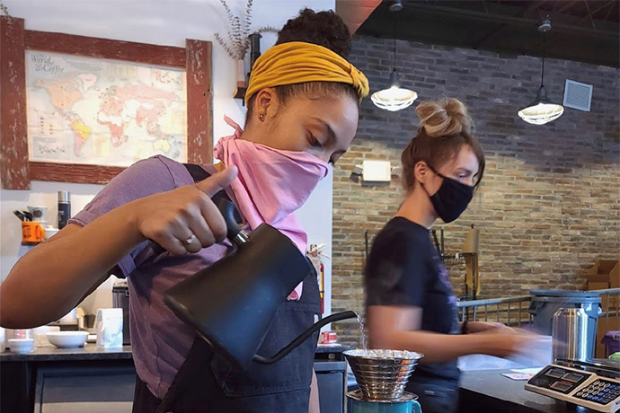 Brandywine barista making pourover coffee with a gooseneck kettle.