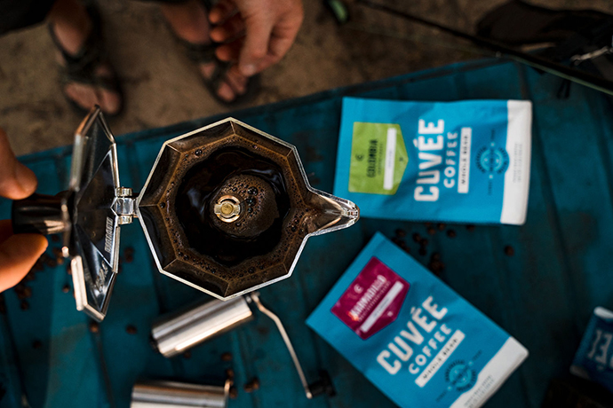 Overhead shot of a moka pot with Cuvée coffee bags in frame.