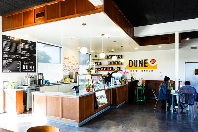 Dune coffee shop location photography with mural in background.