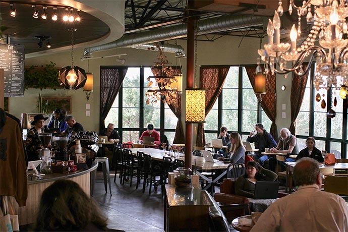 Iconik cafe location shot with chandelier in foreground.