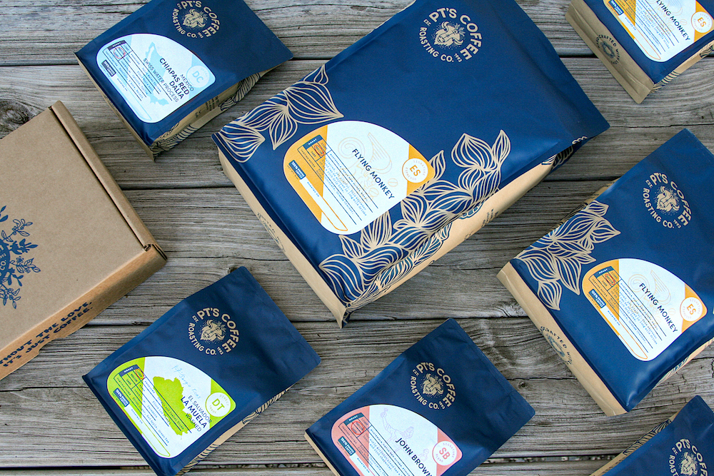 Flat lay of PT's Coffee bags featuring 'Fleur Del Sol'.