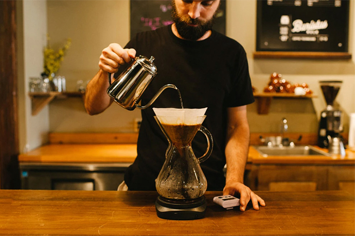 Quills pourover coffee being made by a barista.