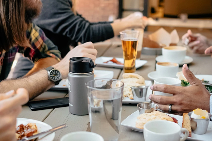 Cafe location with many cups and plates in various positions.