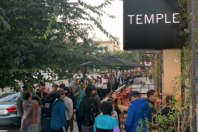 People queuing up outside Temple cafe location.