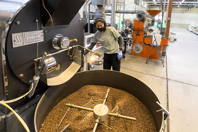 Temple Coffee roaster operating their Renegade Roasters machine.