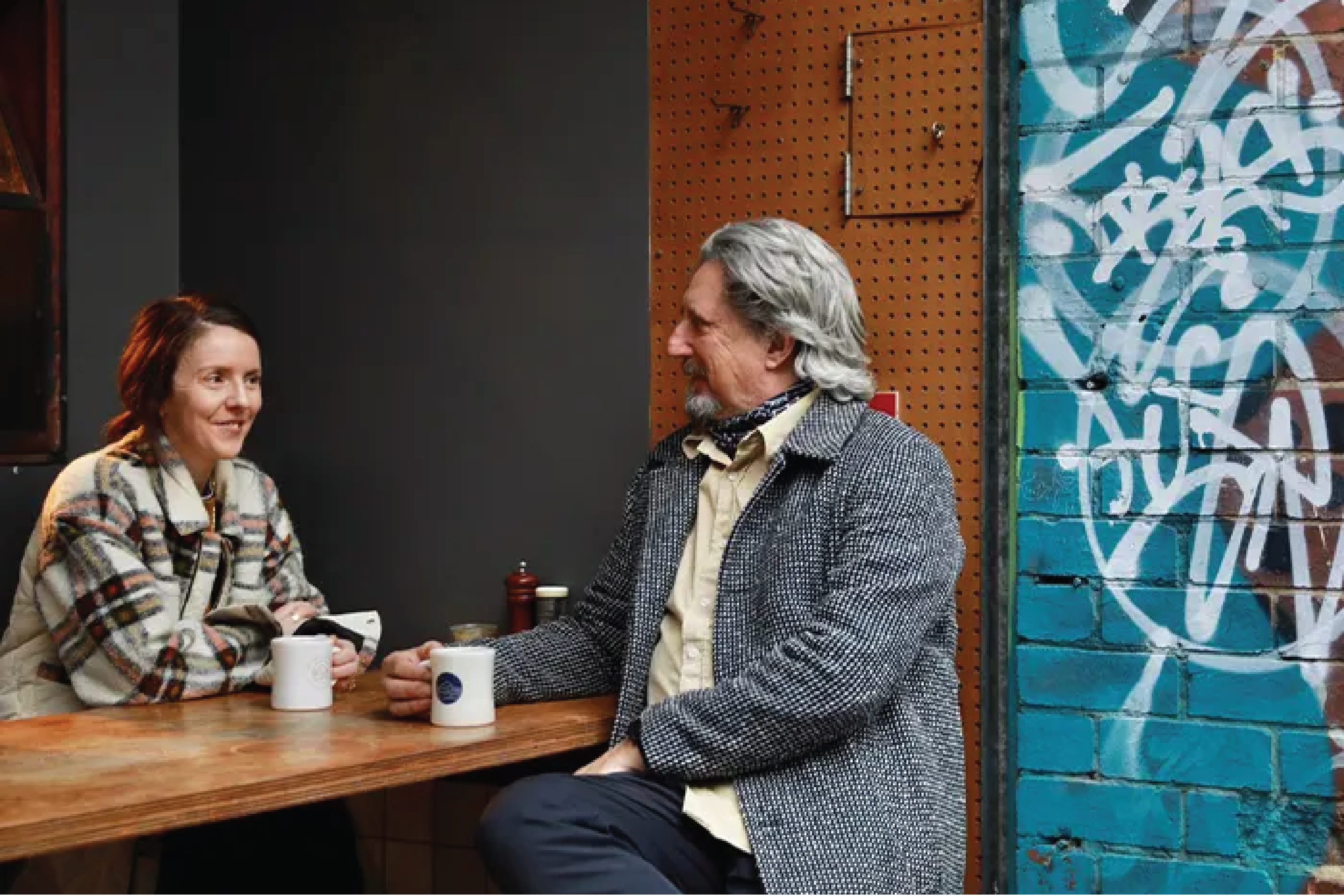 Man and woman at seven seeds coffee counter